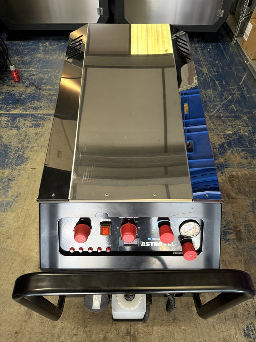 A mobile full electric Boss Boys pressure washer with control buttons visible on the front panel. The main body is silver, and the control buttons are red and white.